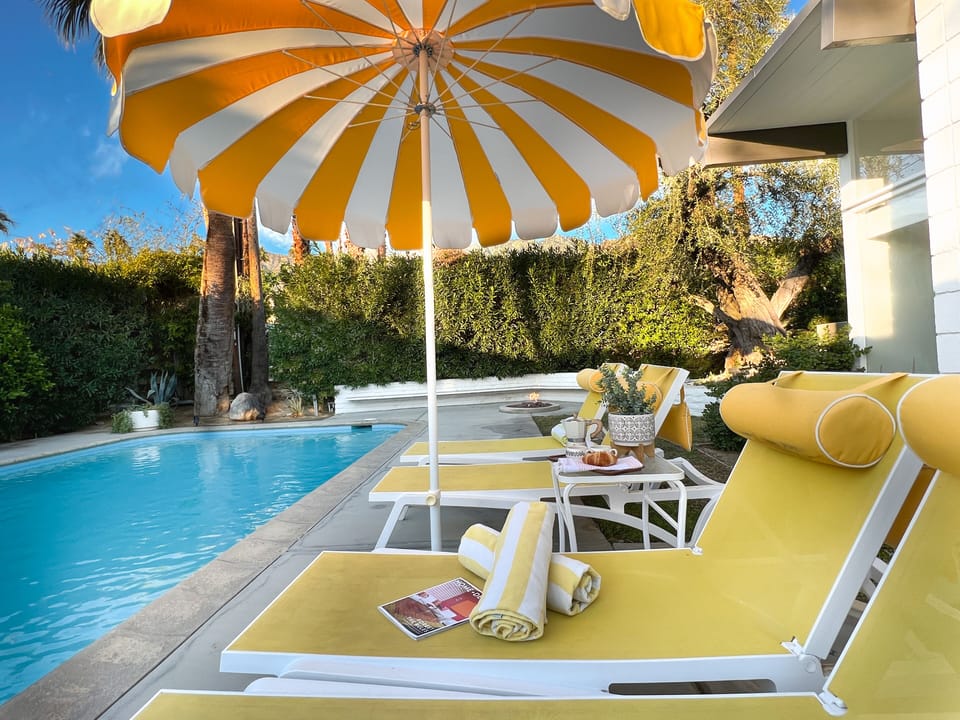 Lounge by the sparkling pool in the desert sunshine with lovely mountain views