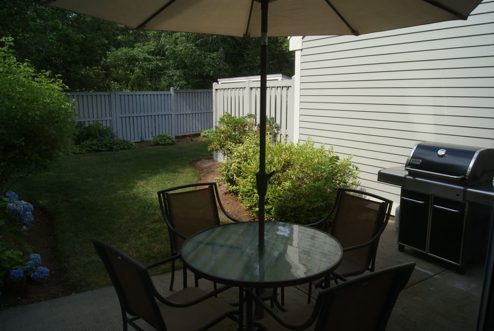 Patio off of living & dining area - includes umbrella table and full size grill.