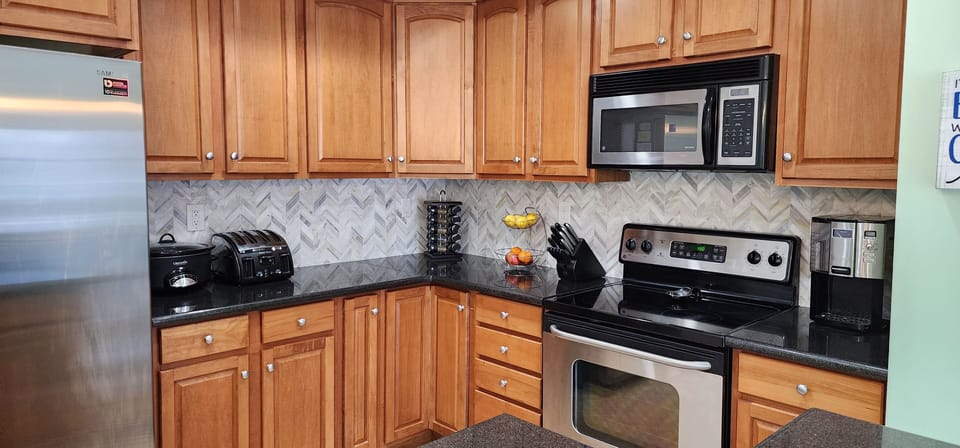Newly remodeled kitchen with marble backsplash. 