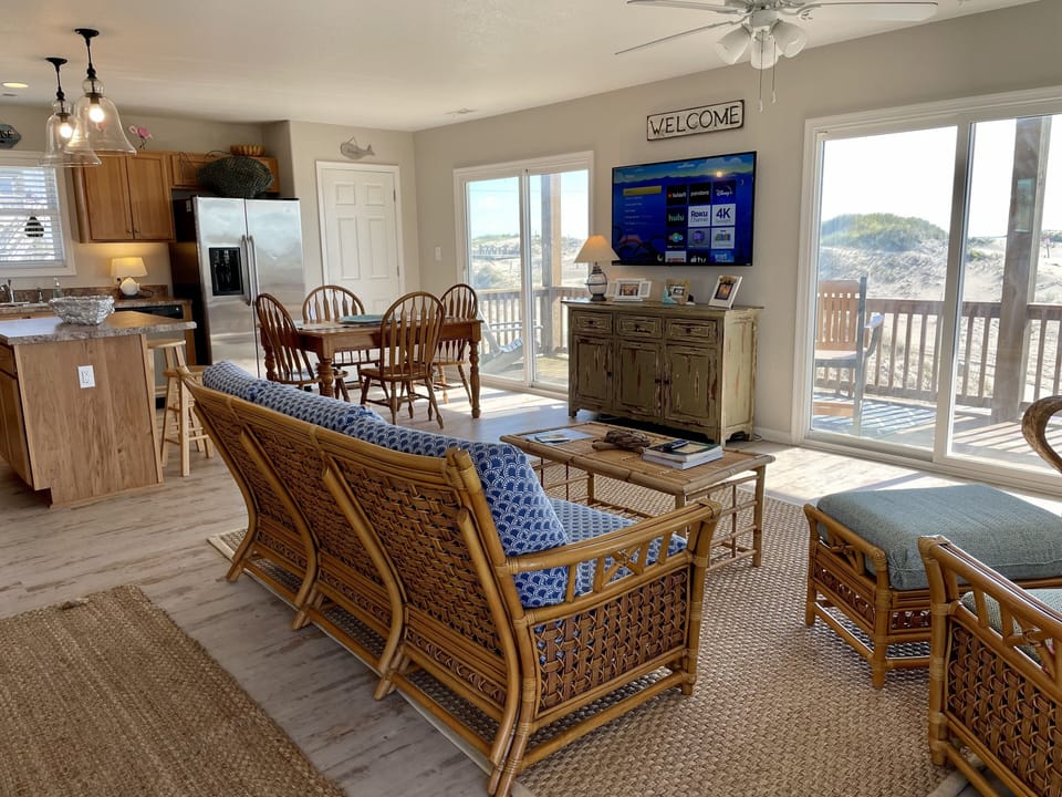 Great room with flat screen TV and stunning views of the ocean