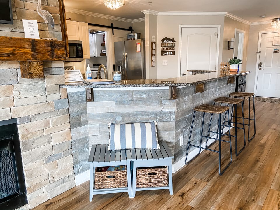 Beautiful continuous flooring throughout; stone fireplace & distressed wood!h