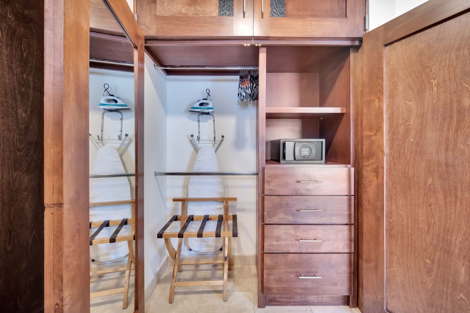 MASTER CLOSET WITH IRON & IRONBOARD.