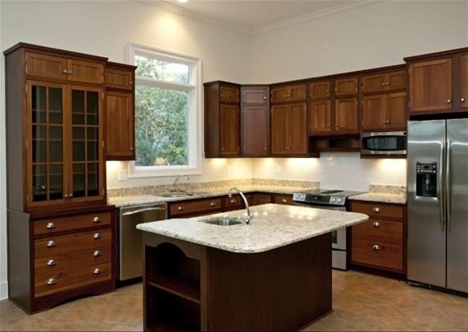 A new kitchen features plenty of workspace and is fully equipped!    