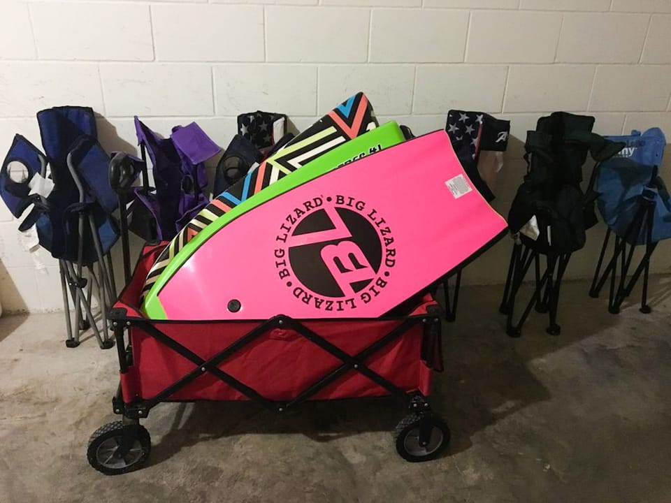 beach gear including chairs, boards, and wagon for your enjoyment 