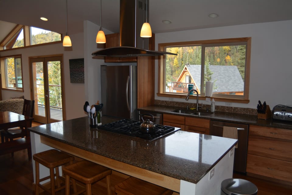 Commercial stovetop, two dishwashers and a double oven.