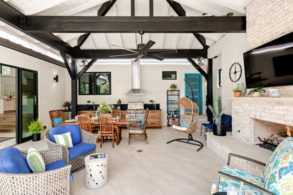 Cozy up by the outdoor fireplace with large television and speaker system