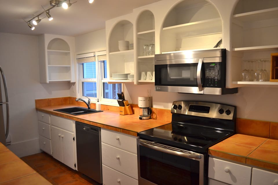 Galley style kitchen with new stainless steel appliances
