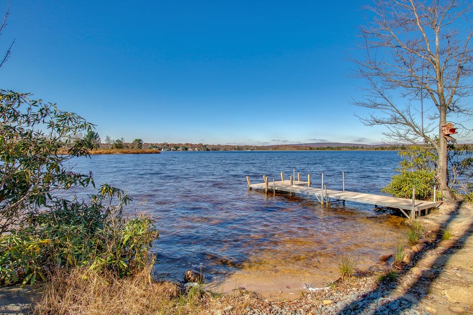 The lakefront access of this Poconos rental by the lake, complete with dock.