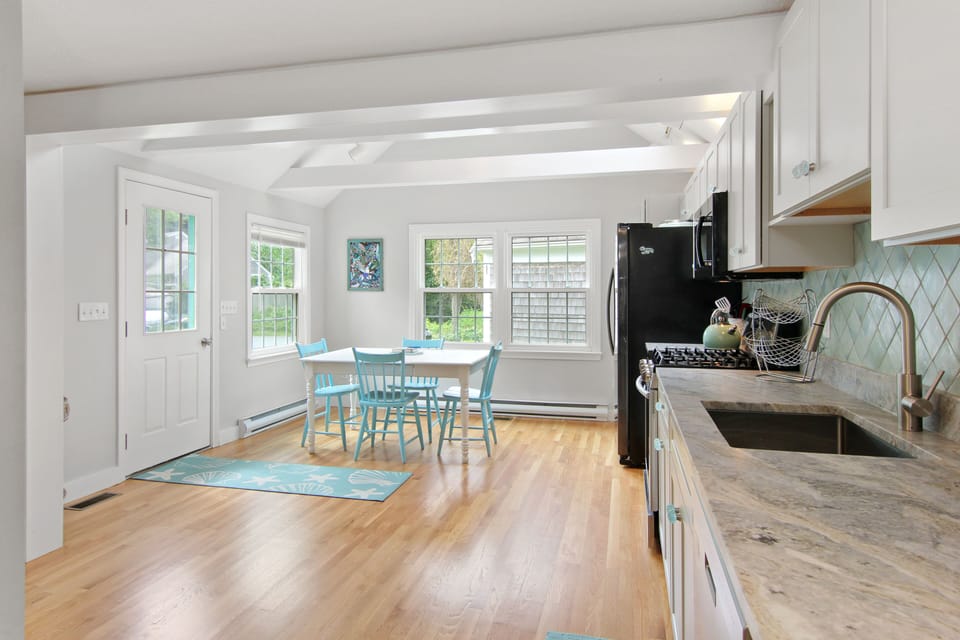 Open kitchen plan, new cabinetry, granite countertops, beach glass knobs