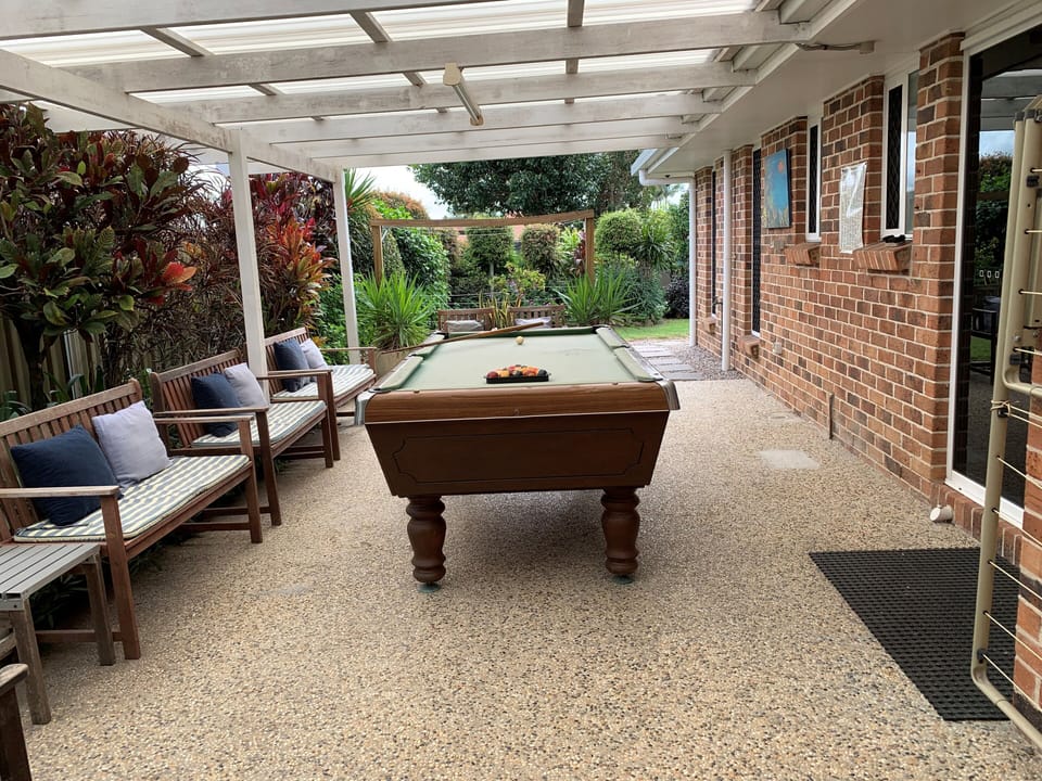undercover pool table area behind garages
