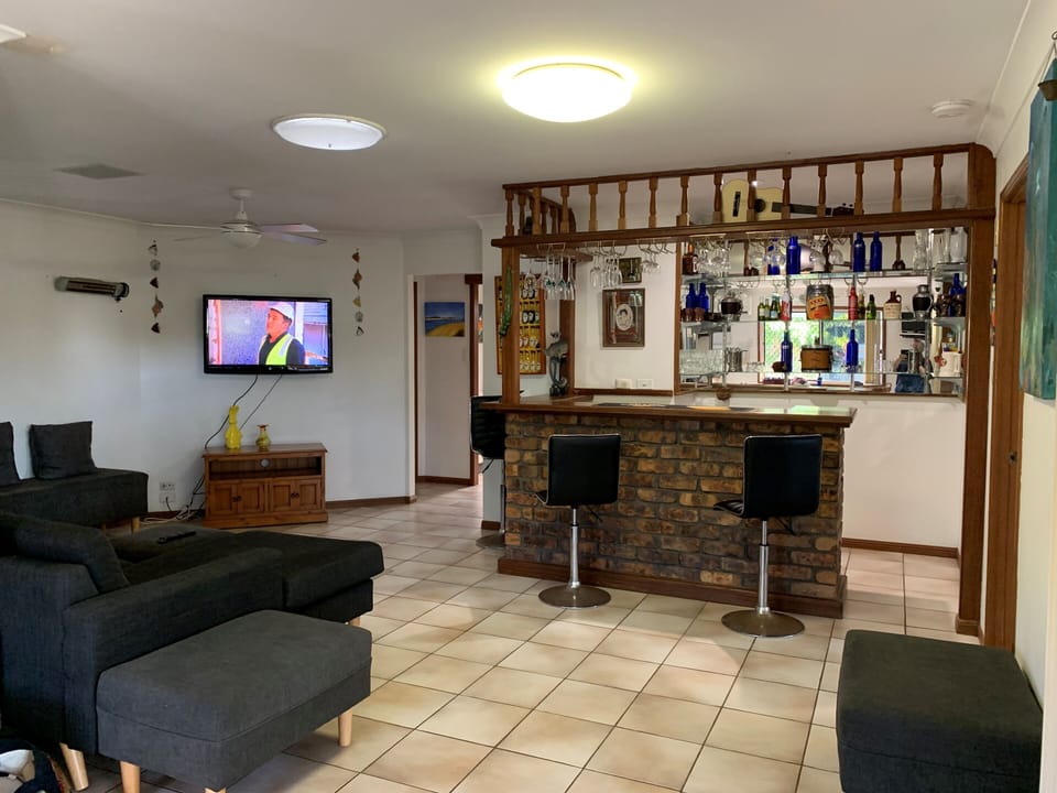 bar area. lounge and TV area
