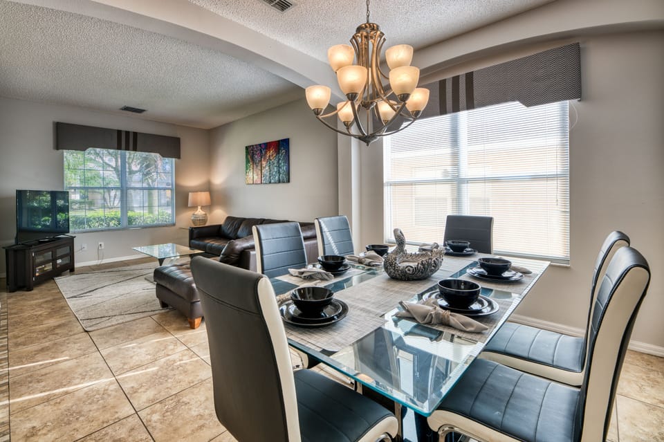 Large modern formal dining adjacent to living room