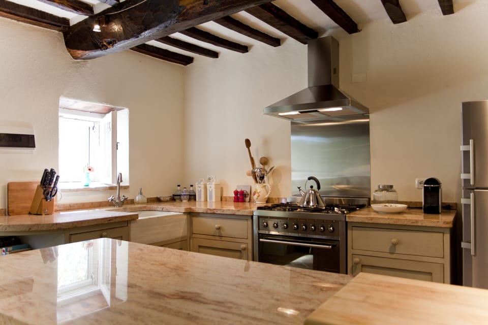 Hand made kitchen units topped with pink marble!