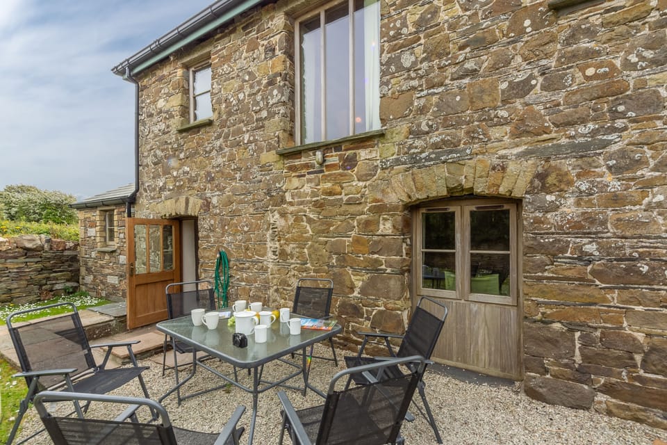 Spring Barn, Rock. Outdoor seating and a gas barbecue