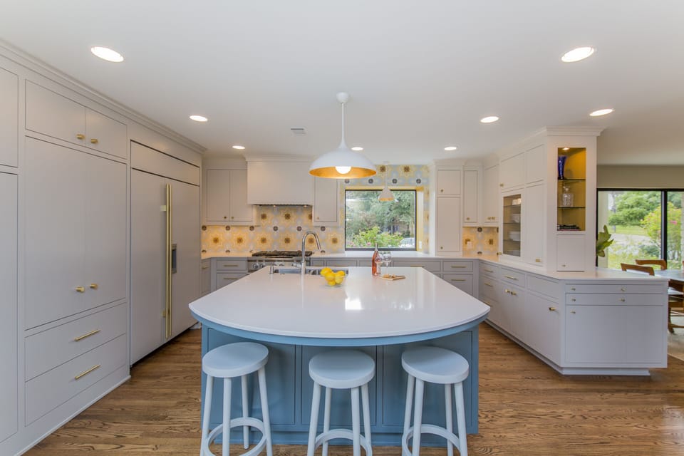 Large gourmet kitchen with high-end appliances, sub-zero fridge, 6-burner stove.