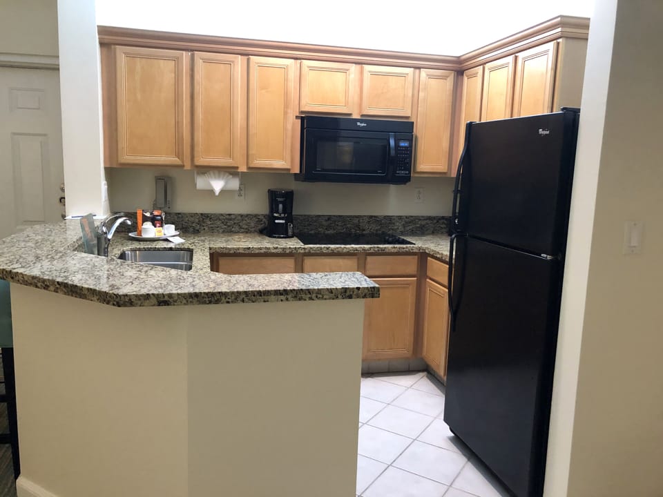 Fully equipped kitchen w/ full fridge, cooktop, convection microwave, dishwasher