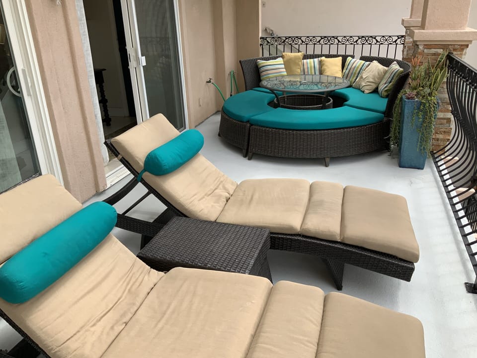 Private balcony directly off of the living room with 2 lounges for relaxing.



