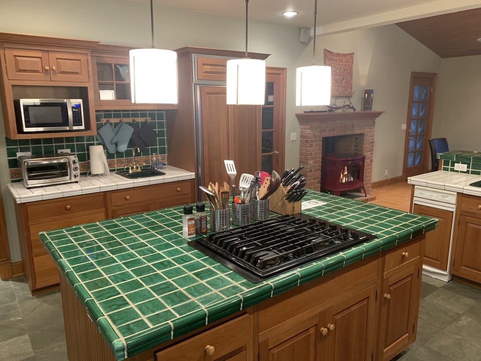well-appointed kitchen with new stove top (also two sinks, Subzero fridge, etc.)