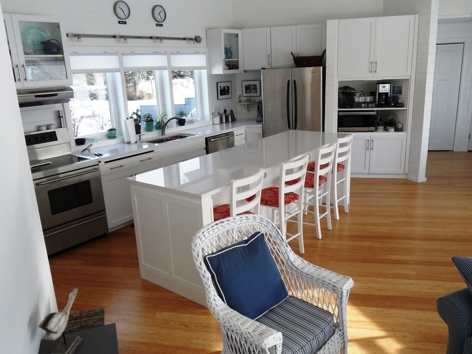 Quartz counters, 36" elect range, dual oven, large refrigerator, coffee bar.