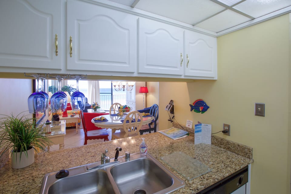 Double sink faces towards living/dining areas and beautiful view
