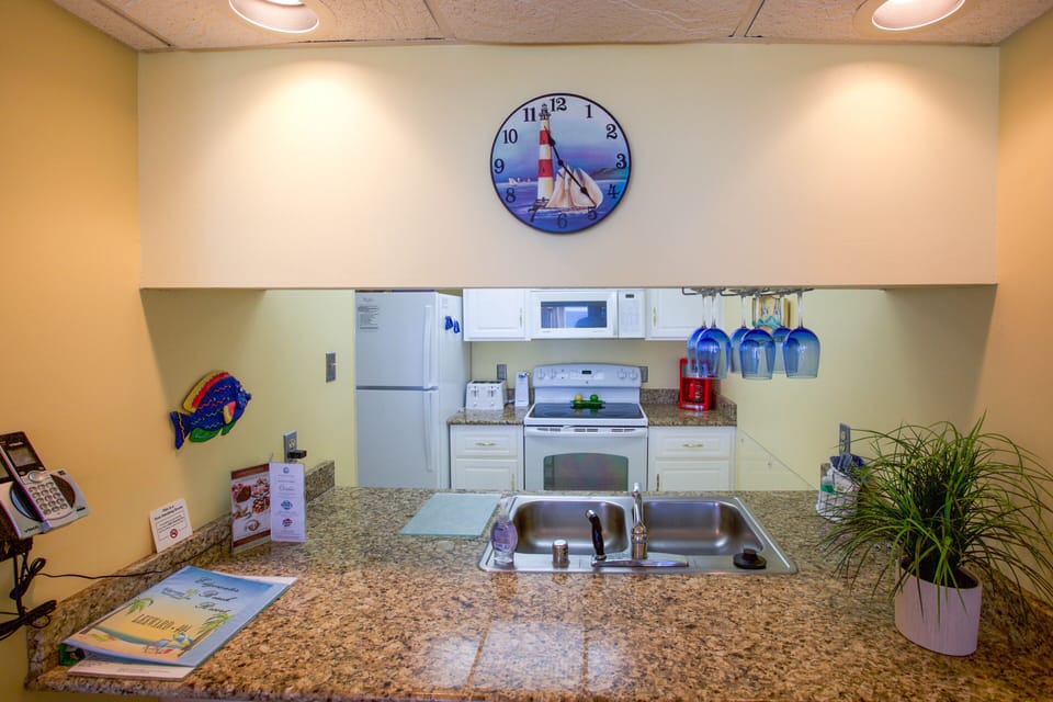 Full size fridge, stove/oven, dishwasher, coffee maker, toaster, can opener, etc