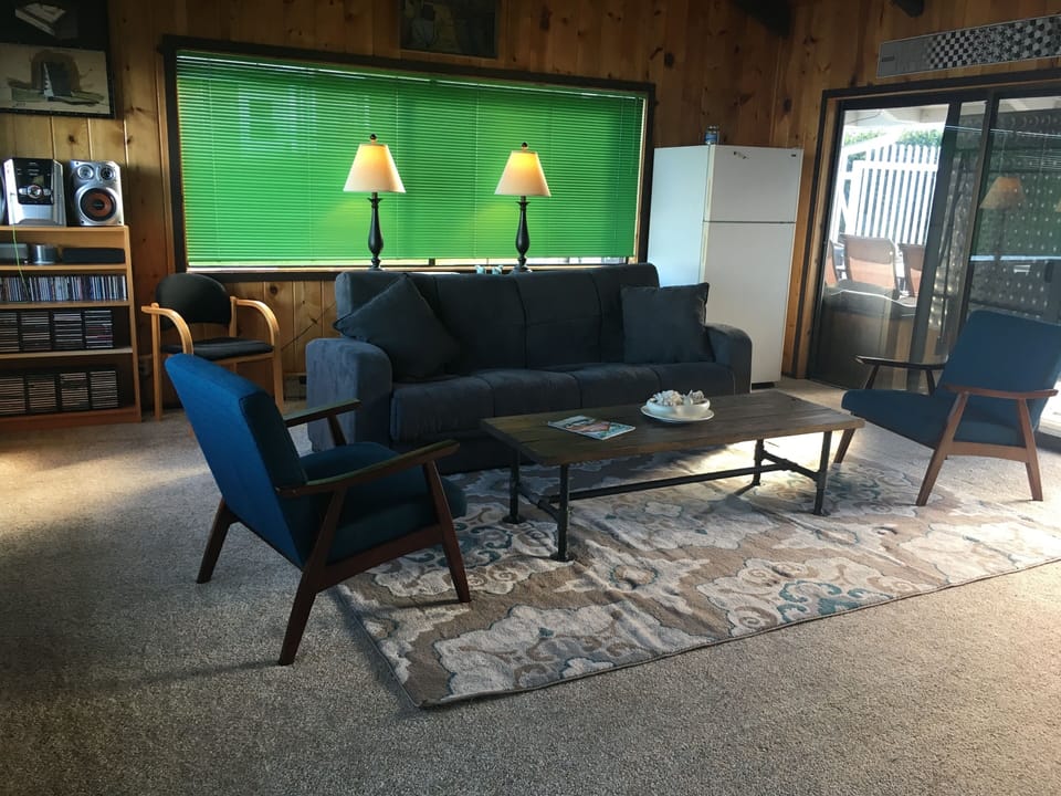 Side "pool-room" with double sleeper sofa & game systems.
 
