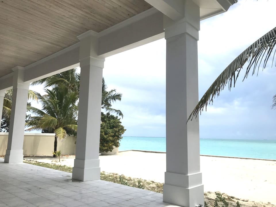 Step off the elegant patio on to the fine sand beach lawn 