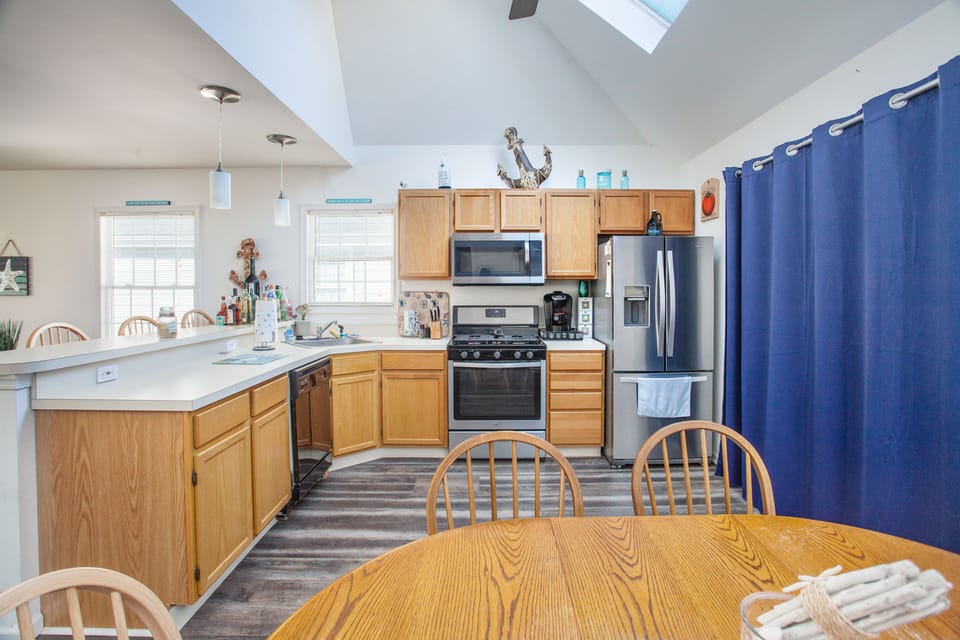 Kitchen has table seating for 6 and counter seating for 4