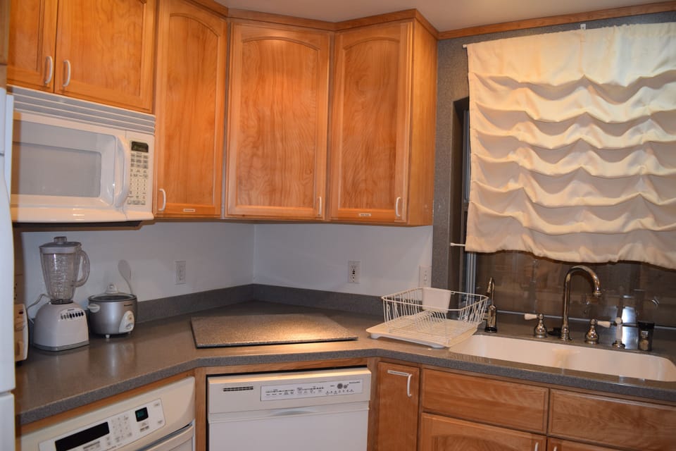 Plenty of counter space with large refrigerator, six bottle wine fridge.