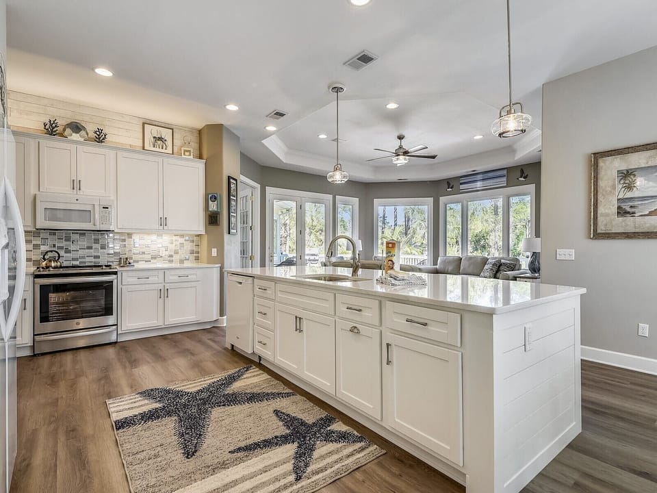 Our redesigned kitchen layout with island joins space with Carolina Room