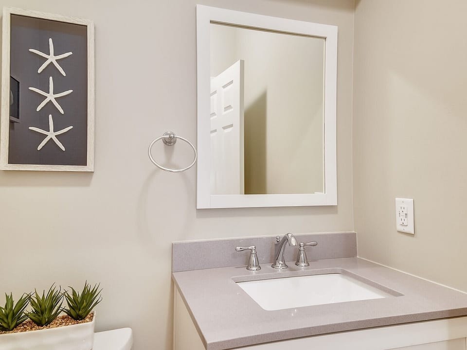 Located between kitchen/steps to mid & 2nd level used at night by bonus room.