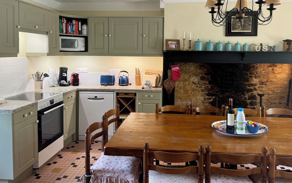 Built in kitchen cupboards with multiple coffeemakers and USB plugs. 