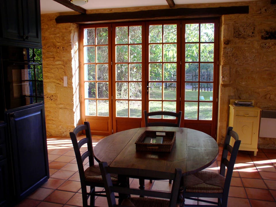 Converted Barn breakfast table looking out to garden.