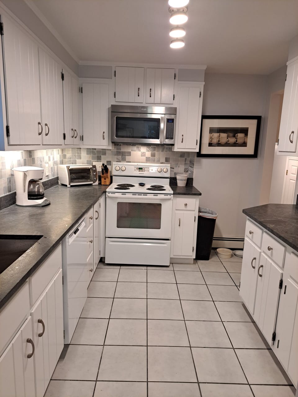 Lower Level Kitchen #2 with new sink, quartz countertops and backsplash