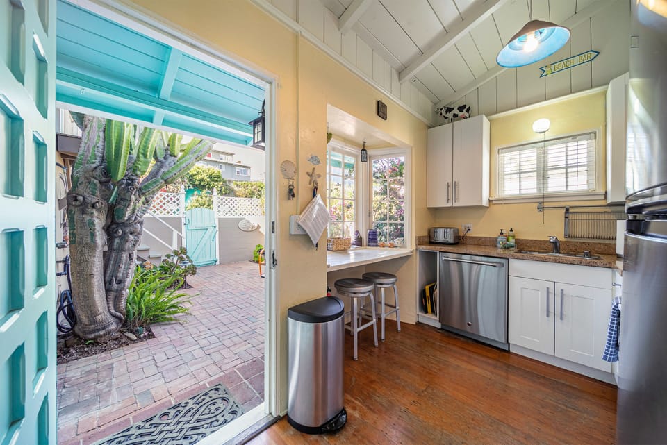Kitchen opens to rear patio w/ Laundry and Coast Hwy access