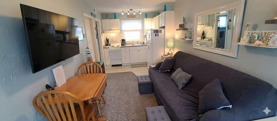 Spacious living room with 4K HDTV which has a YouTube TV subscription.