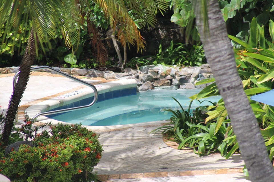 Relax in the hot tub next to the beautiful pool