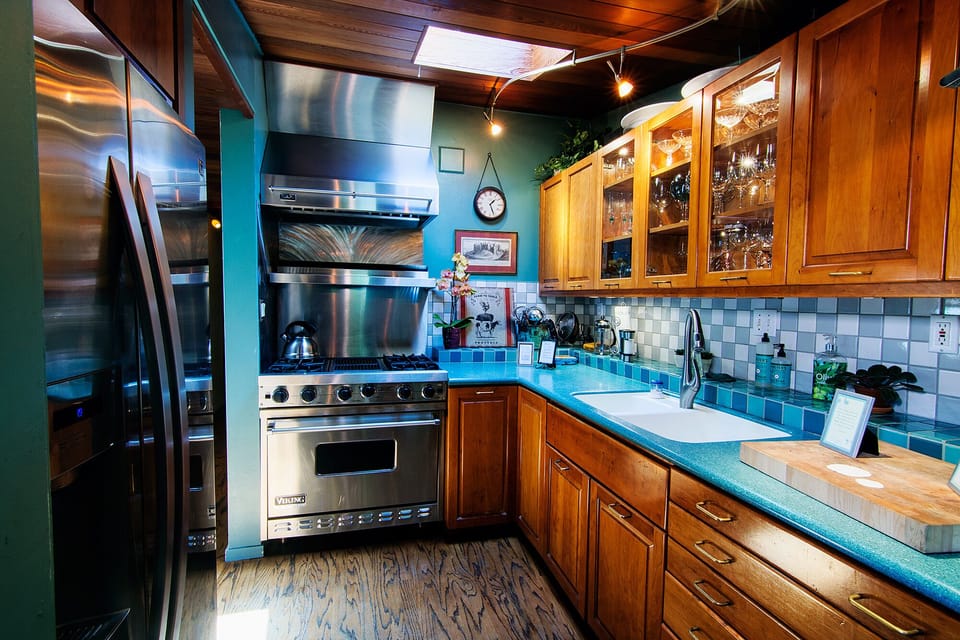 Gourmet kitchen. Viking range/oven, cherry cabinetry, copper pots, fully stocked