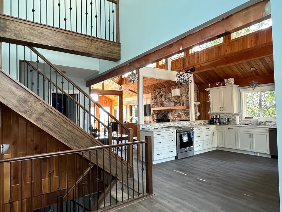 View from the front entrance into the kitchen, living room and sunroom.