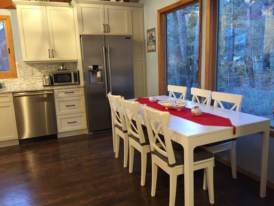 Kitchen table sits up to 10 people easily with extra leaf inserted. 