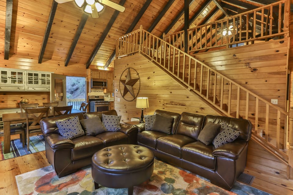 Sitting and dining area with steps up to the loft. 