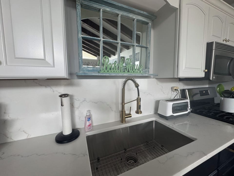 Updated Kitchen with quartz counter and backsplash.