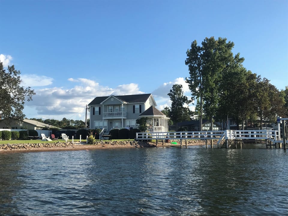 Water view of the home, yard and dock