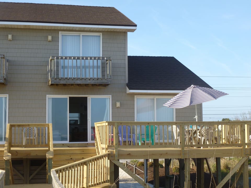 BIG deck with dining table, rocker, lots of chairs and room to lay out and tan.