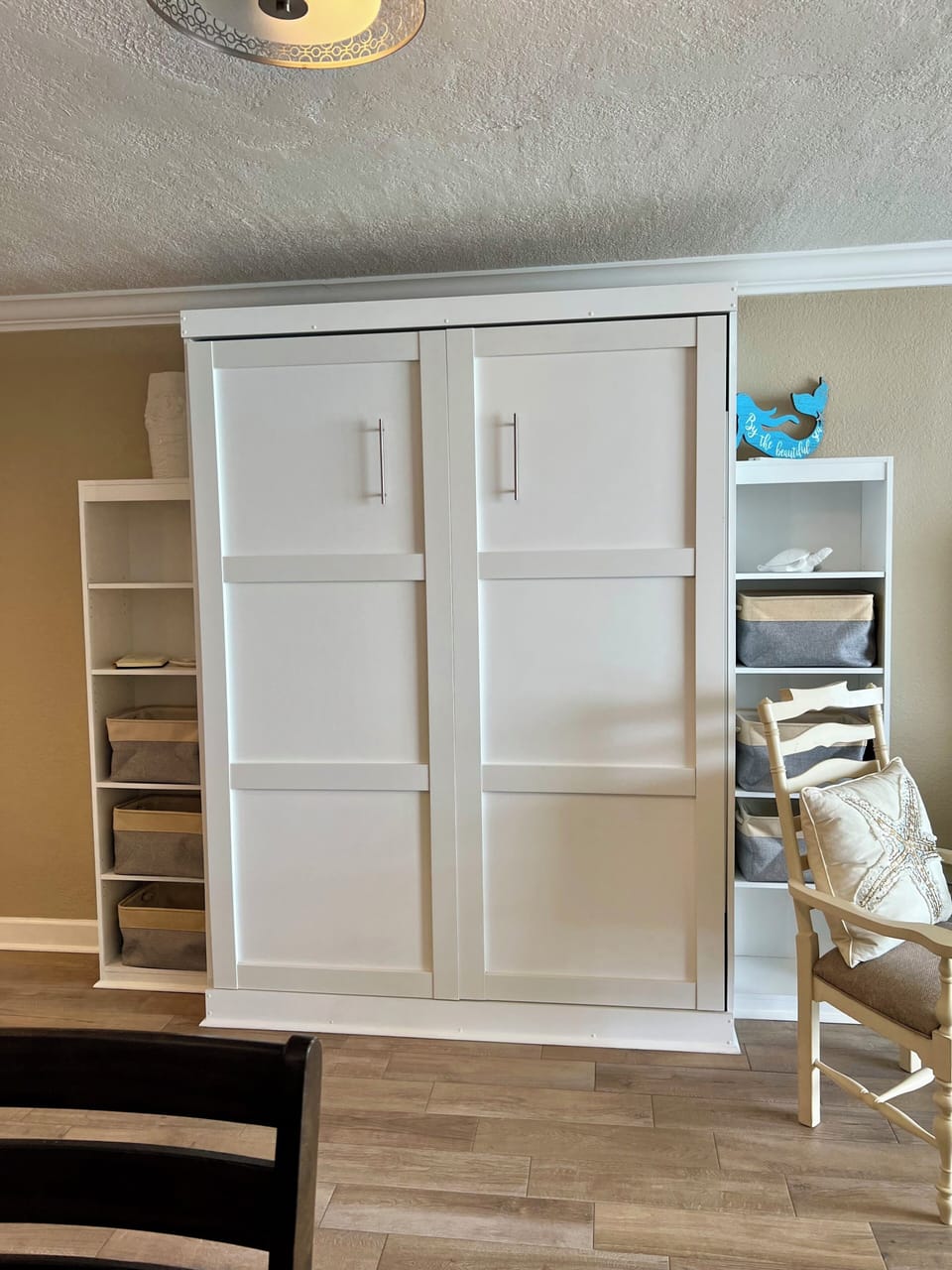 Queen murphy bed and shelves for storage