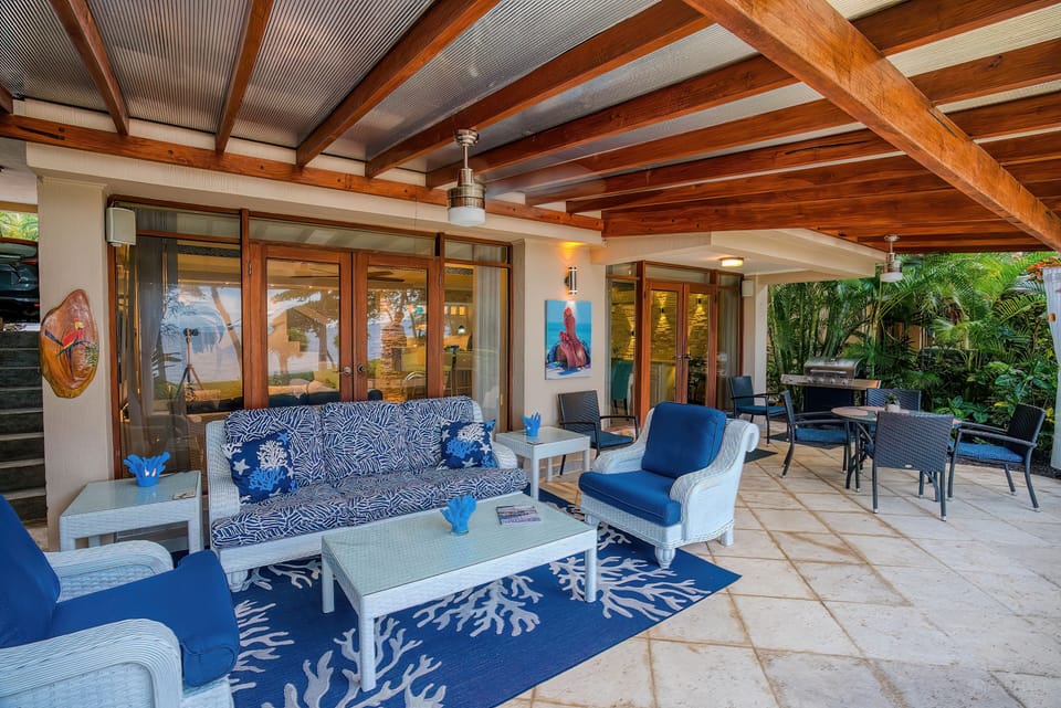 Outdoor living and dining, with gas grill.  Fans, evening lighting on the beach.
