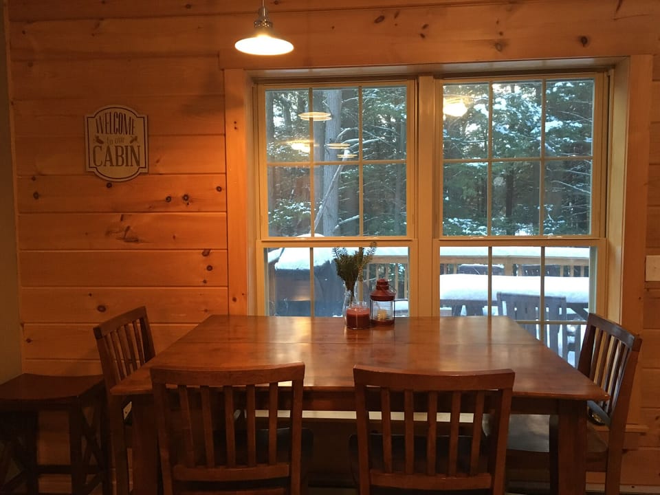 High-top, extendable dining table with view of the deck