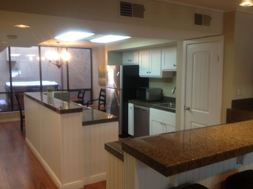 HOT TUB BEYOND KITCHEN
