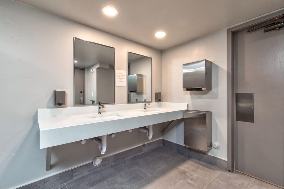 Basement area rest rooms with adjacent showers and changing area