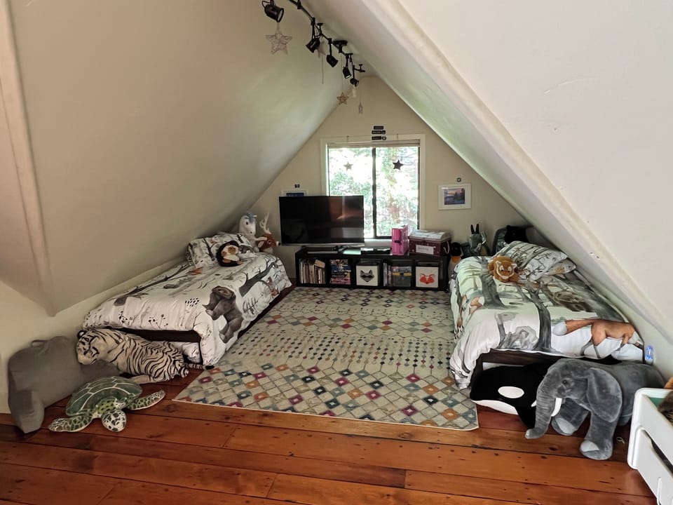 Bedroom #4 with 4 single beds.  Has 3d TV and 3d Blu Ray Player!  